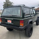 Illustration for article titled At $4,999, Does This Raised Up 1996 Jeep Cherokee Come With a Jacked Up Price?em/em